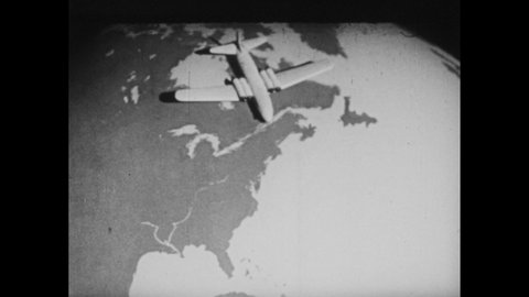 1950s: Model of airplane sits on North Pole on globe of Earth. People in snow with dogs. Model of airplane on globe. Trees and bushes. Airplane on globe moves locations.