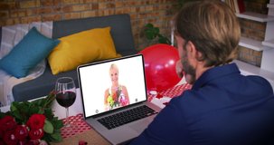 Caucasian couple on a valentines date video call smiling woman on laptop screen holding flowers. online valentines day during quarantine lockdown.