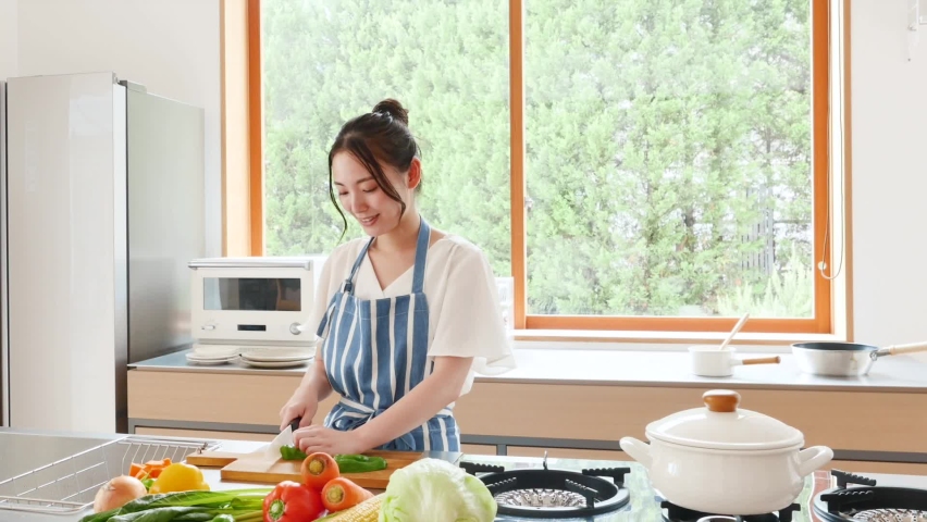 Asian woman cooking at home Royalty-Free Stock Footage #1066932214