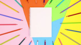 6k Colored pencils move around notebook on colorful theme. Stop motion