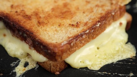 hot double sandwich with cheese on pan. grilled cheese sandwich close up