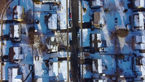 Frederick, Maryland - February 4th, 2021: Snow covered neighborhood top down view 4k