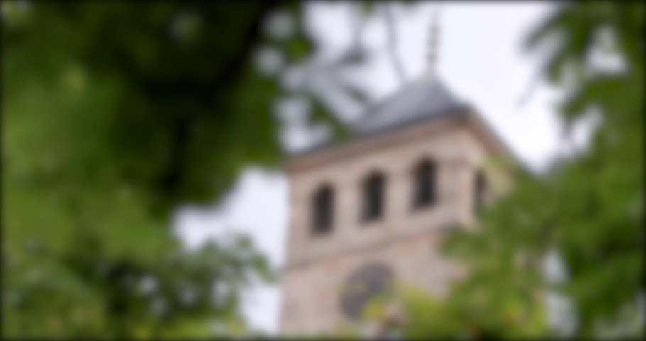 Footage of the clock tower near the beys mosque in Sarajevo, Bosnia and Herzegovina, the shot is coming into focus