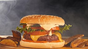 Smoke clouds envelop a tasty burger with crispy countrylike potato  - Powered by Shutterstock - Get 15% off with code: PIKWIZARD15