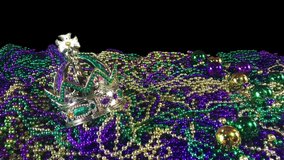 Shining glitter crown on huge pile of Mardi Gras beads with copy space - Powered by Shutterstock - Get 15% off with code: PIKWIZARD15