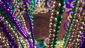 curtain of Mardi Gras beads parting to reveal colorful bead border with copy space - Powered by Shutterstock - Get 15% off with code: PIKWIZARD15