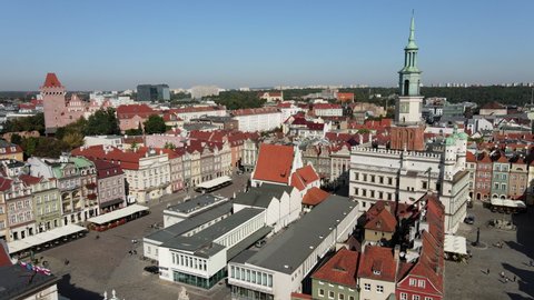 Colorful buildings located on a main square of Poznan City. Stary Rynek square with colorful houses and old Town Hall in Poznan, Poland. Merchant houses. Aerial view on Poznan main square.