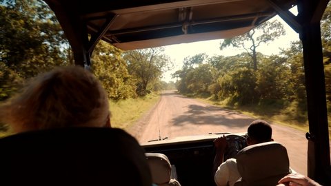 Woman On Africa River Safari Adventure. Safari Trip On Tanzania Selous. Tourist In Hat On African Safari Adventure On Holiday Vacation. Wild Nature Of Search Lions And Giraffe Serengeti Or Ngorongoro