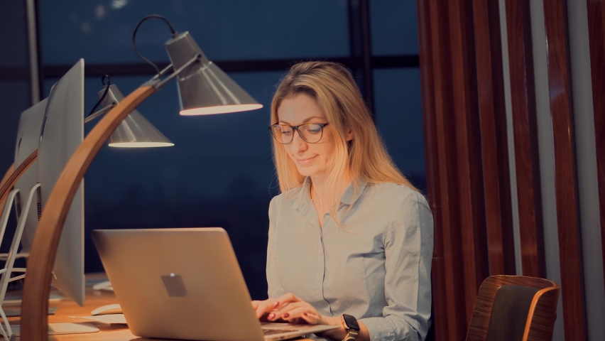 Saleswoman Analyzing Charts On Laptop. Focused Trader Reading Corporate Financial Audit Report Document.Serious Online Trader Work Stock Market Data.Businesswoman Lawyer Working In Office On Workplace | Shutterstock HD Video #1066980439