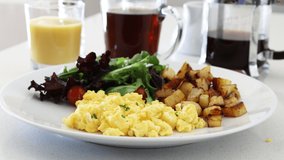 Scrambled Eggs and Salad with Tomatoes