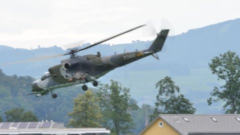 Zigermeet Mollis August 16th 2019: Russian made cold war era gunship helicopter in green camouflage takes off. Mil Mi-24 V Hind E of Czech Air Force