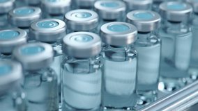 No Logo Vaccine Mass Production in Laboratory, Transparent Bottles without Labels Move on Pharmaceutical Conveyor Belt in Research Lab. Medicine Against Covid-19, Loopable Close Up Footage. - Powered by Shutterstock - Get 15% off with code: PIKWIZARD15