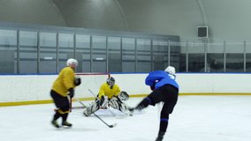 Goalie in protective sports uniform defending gate during hockey match on ice rink - Powered by Shutterstock - Get 15% off with code: PIKWIZARD15