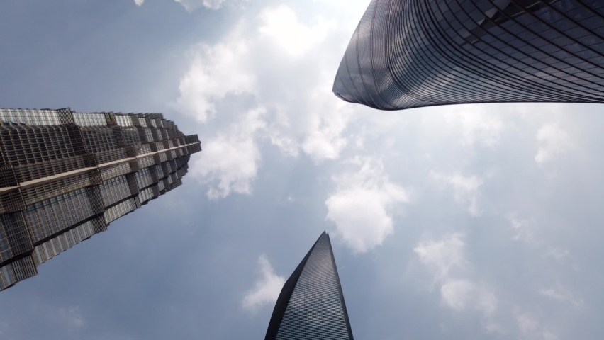 Time lapse view of downtown Shanghai three skyscrapers the Jin Mao Tower the World Financial Center and the Shanghai-tower the tallest towers in largest city on the earth high resolution footage Royalty-Free Stock Footage #1067021377