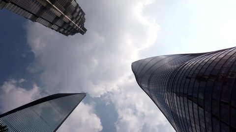 Time lapse view of downtown Shanghai three skyscrapers the Jin Mao Tower the World Financial Center and the Shanghai-tower the tallest towers in largest city on the earth high resolution footage