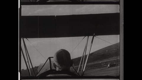 1930s Oshkosh, WI. Daredevil Pilot Flies Stunt Plane into House. The Stuntman Safely Crash Lands. Stunning Pilot POV  in the Cockpit. 4K Overscan of Vintage Archival 16mm Film Print