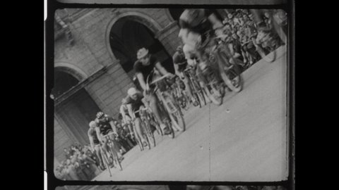 1947 Paris, France. Bicyclist return to the Tour de France after World War II. Riders Ride in the Streets of Paris France. 4K Overscan of Vintage Archival 16mm Film Print 