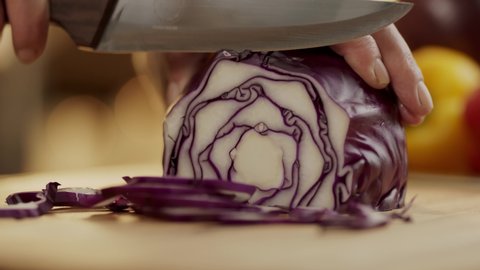 slow motion red cabbage cutting 