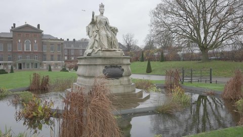 Statue of Queen Victoria in London with Kensington Palace in the background