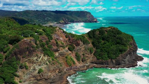 Beautiful Pristine Waves Of Whites And Piha Beaches In Auckland, New Zealand On A Sunny Summer Day - aerial drone, slow motion