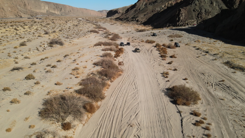 Off-road traffic jam in the desert as vehicles pass each other in Afton Canyon, Mojave Desert, California.