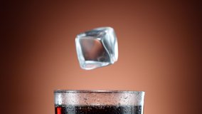 Super slow motion of falling ice cube into cola drink, camera movement. Filmed on high speed cinema camera, 1000 fps - Powered by Shutterstock - Get 15% off with code: PIKWIZARD15