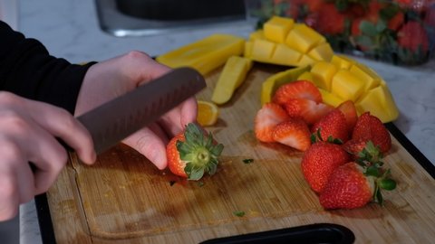 Cutting citrus fruit for smoothies 