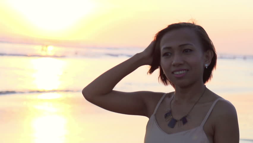 Beautiful  woman walking on the beach during sunset
 | Shutterstock HD Video #10670516