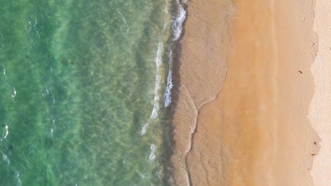 Aerial view of drone. Scene of Top view beach sand and sea water clear. Sea water texture on beach sand.