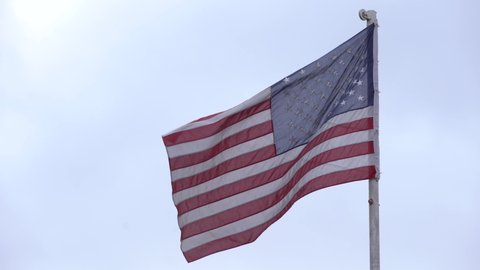 American Flag Waving. Large American Flag flies. US flag