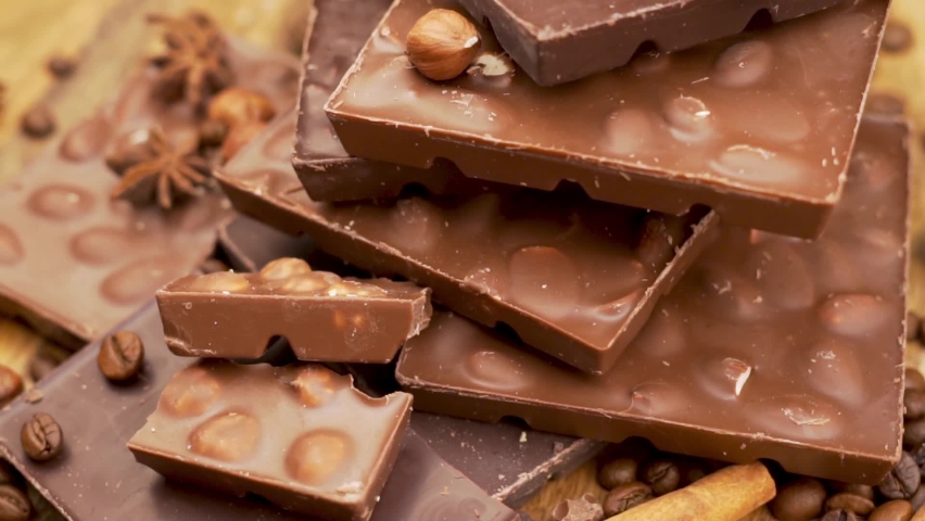 Delicious Chocolate Bars with Nuts made from Dark and Milk Chocolate. 