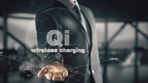 QI Wireless Charging with hologram businessman concept