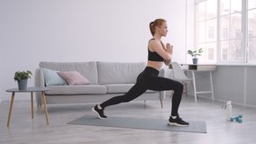 Fitness Woman Doing Forward Lunge Stretches Standing Opposite Leg And Arm Exercising At Home, Wearing Fitwear. Stretching And Flexibility Workout Concept