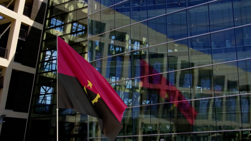 Angola Flag Waving On A Skyscraper Building Royalty-Free Stock Footage #1067090542