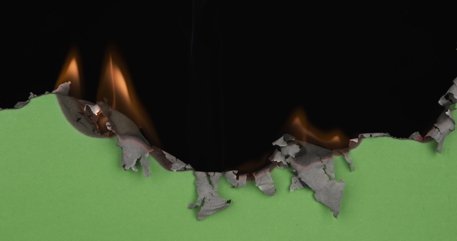 Green paper burns, revealing burnt edges, smoke and turns into ashes. Burning green screen. Black background | Shutterstock HD Video #1067098321