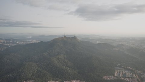 Aerial Hyperlapse at mountains around huge city with fog. Sao Paulo city in the background