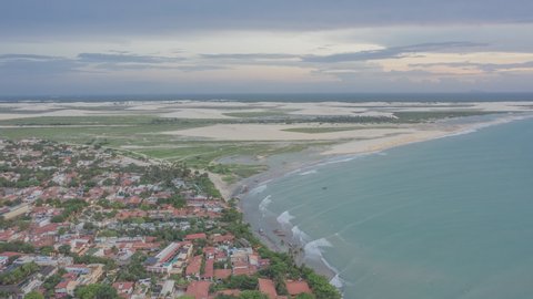 Aerial Hyperlapse of people moving at Jericoacoara on cloudy day. National Park, Brazil