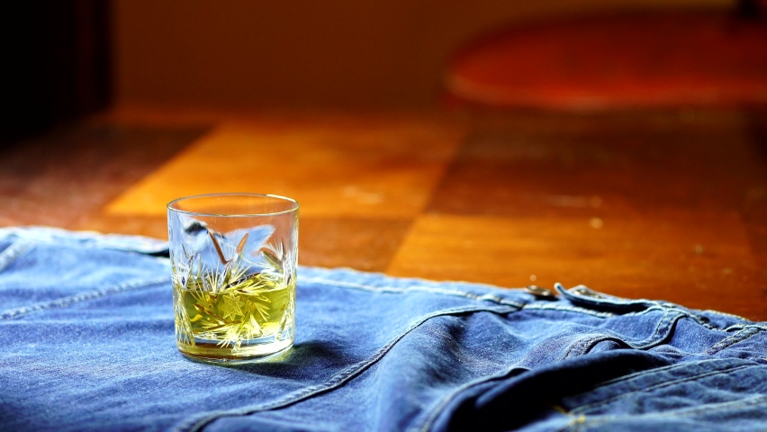 
businessman drinking whiskey. Drinking whiskey alone at home. Relaxing after work. Alcohol tasting