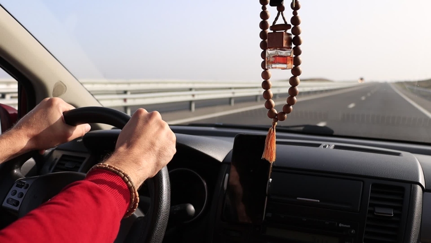 Man driving a car - slow motion footage.