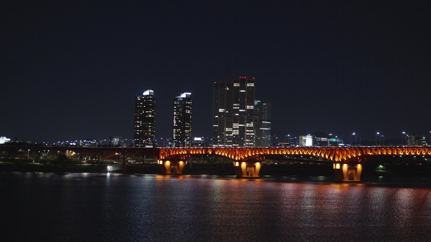 Seongsu Bridge in capital city Seoul lit up by street lights crossing Han River at night