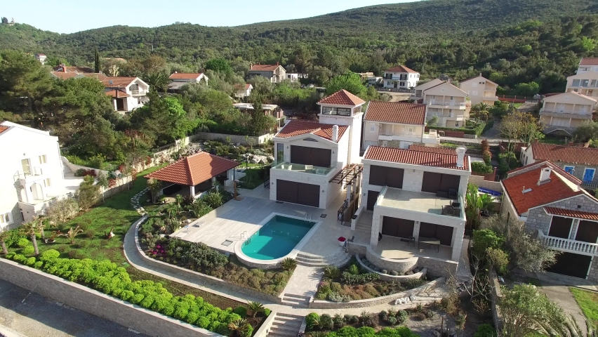 Beautiful luxury two-storey villa on a green slope in Montenegro 