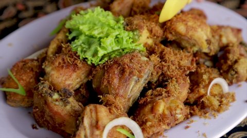Established Shot of Fried Chicken with Serundeng Topping