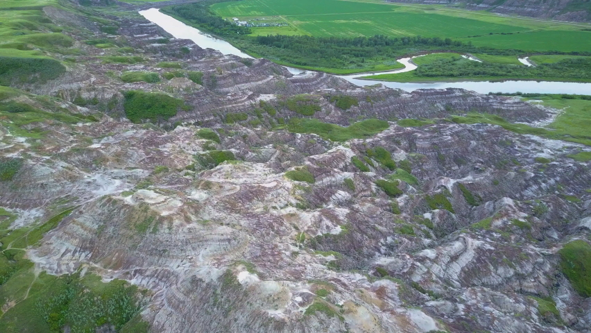 Wonderful and peaceful view of small rock formations by the river. Inspirational view from above of the cliffs near the river