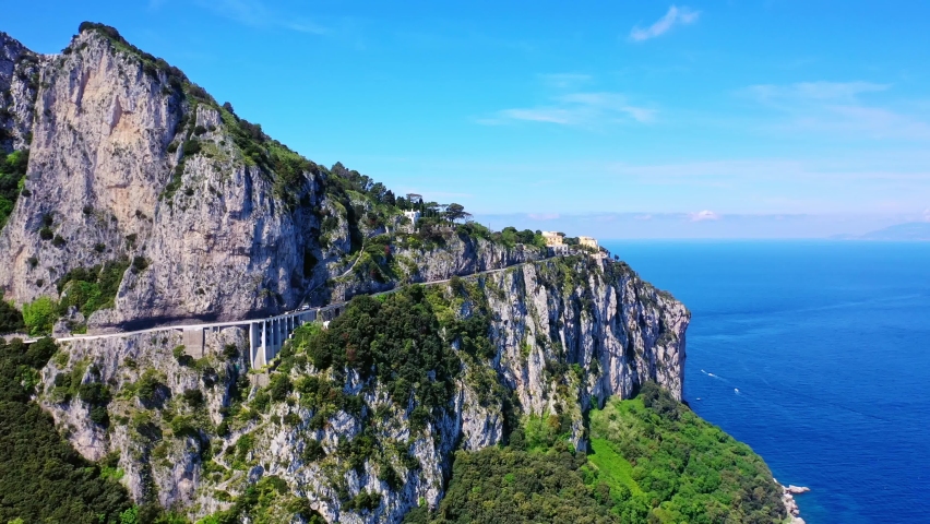 Drone shot of beautiful view of the road and sea on Capri Island, Italy Royalty-Free Stock Footage #1067129458