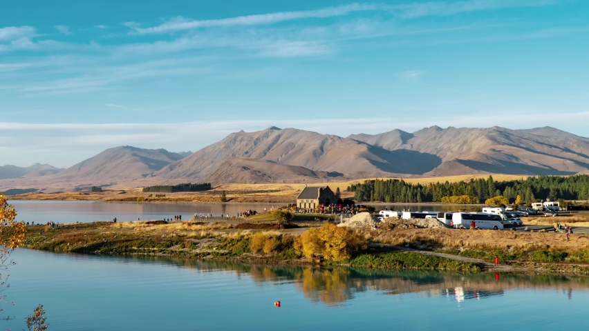 Lake Tekapo in Mackenzie Basin in the South Island of New Zealand, people being busy from morning to night, time lapse of beautiful natural landscape