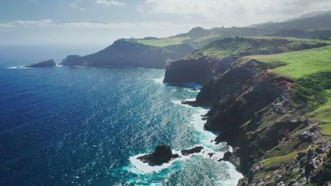 Scenic rocky coast nature background. Traveling pure nature of tropical island Maui, Hawaii, USA. Cinematic aerial view of wild nature the world famous coastline. Outdoors adventure and travel 4K