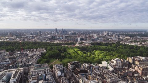 Establishing Aerial View Shot of London UK, the Green Park and Buckingham Palace, United Kingdom, day. very light clouds