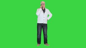 Angry senior man making a call on a Green Screen, Chroma Key. - Powered by Shutterstock - Get 15% off with code: PIKWIZARD15