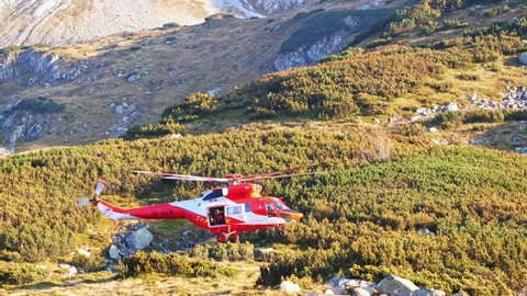 Tatra mountains, Poland - 09 23 2018: The Polish Medical Air Rescue helicopter taking off. Teams of mountain rescuers and a medical crew of Tatra Volunteer Rescue Service.