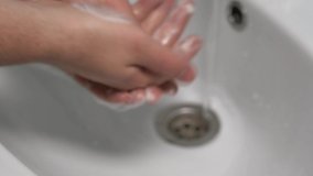 Blurred Video. Background Male Hands Wash Each Other With Soap At Home Sink Bathroom